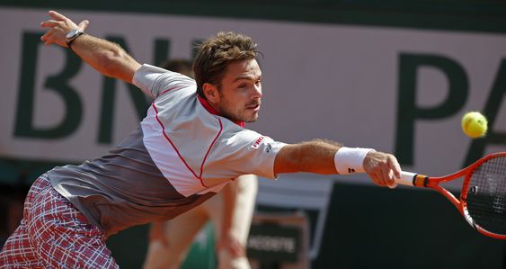 Switzerland's Stan Wawrinka returns in the men's final of the French Open tennis tournament against Serbia's Novak Djokovic in Paris France. The French Open begins on Sunday