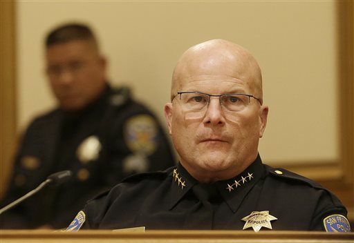 San Francisco Police Chief Greg Suhr right listens to public speakers during a meeting of San Francisco's Police Commission in San Francisco Wednesday Dec. 9 2015. Suhr wants city officials to arm his department with Tasers amid continued protes