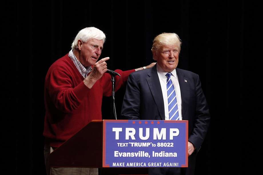 Former Indiana basketball coach Bobby Knight stands next to Republican presidential candidate Donald Trump during a campaign event in Evansville Indiana on Thursday. While he leads polls in Indiana with a message of protectionism and saving jobs few Ho