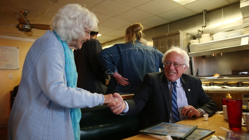 Madonna Rea shakes hands with Democratic presidential candidate Bernie Sanders as he has breakfast at Peppy Grill on Tuesday in Indianapolis Indiana