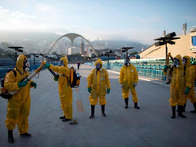 Health workers getting ready to spray insecticide to combat the Aedes aegypti mosquitoes that transmit the Zika virus in Rio de Janeiro