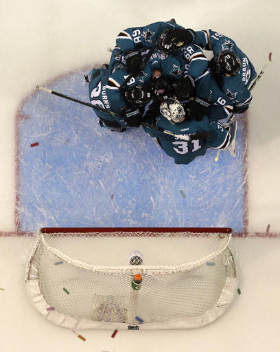 San Jose Sharks players celebrate a 5-0 win over the Nashville Predators during Game 7 in an NHL hockey Stanley Cup Western Conference semifinal series Thursday