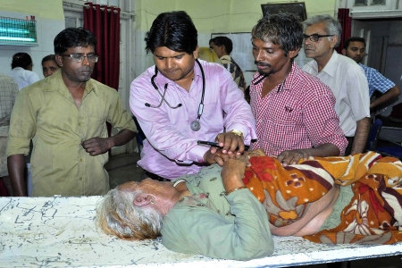 Doctors attend to an injured pilgrim