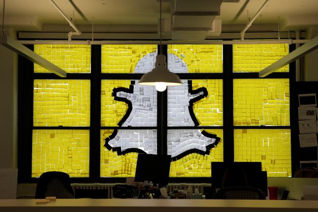 An image of the Snapchat logo created with Post-it notes is seen in the windows of Havas Worldwide at 200 Hudson Street in lower Manhattan New York U.S