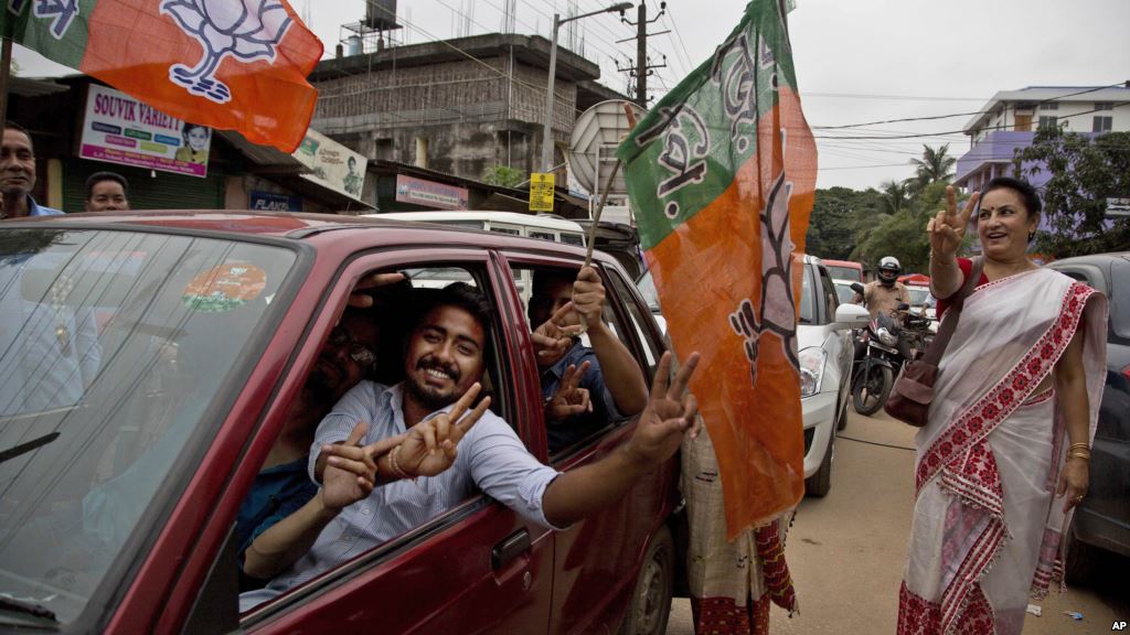 Bharatiya Janata Party supporters celebrate their party's win in state assembly elections in Gauhati Assam state India