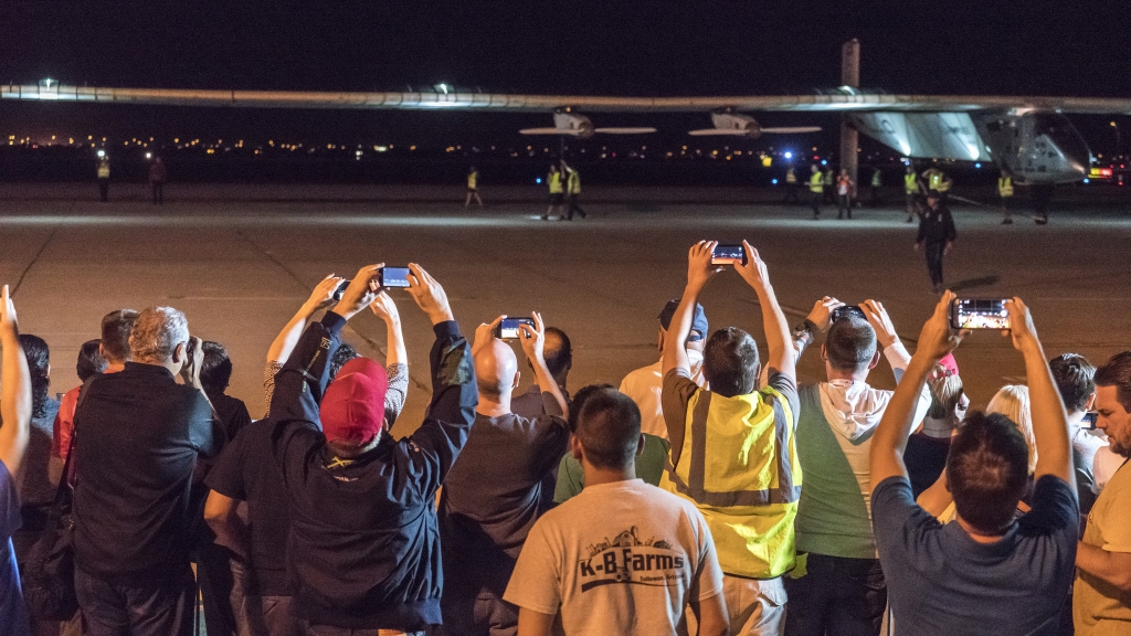 Spectators turned out to watch the Solar Impulse 2 solar airplane land at Phoenix Goodyear Airport on Monday night