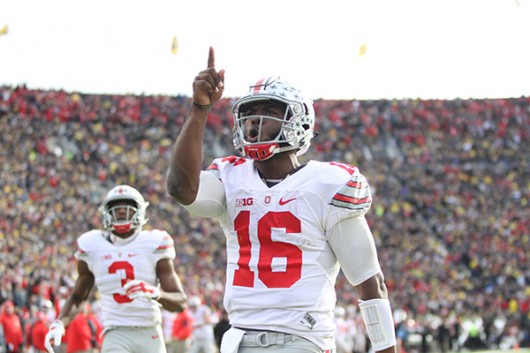 OSU then redshirt-sophomore quarterback J.T. Barrett celebrates after a touchdown during a game against Michigan on Nov. 28 at Michigan Stadium in Ann Arbor Michigan. Credit Samantha Hollingshead