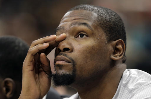 Oklahoma City Thunder forward Kevin Durant sits on the bench during the fourth quarter of the team's loss to the San Antonio Spurs in Game 1 of a second-round NBA basketball playoff series Saturday