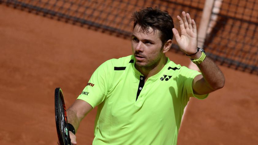 Stanislas Wawrinka celebrates winning his men's singles second round match against Taro Daniel at the Roland Garros in Paris yesterday