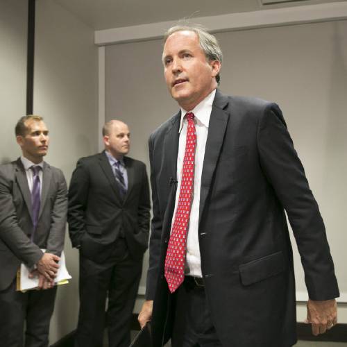 Attorney General Ken Paxton walks away after announcing Texas&#039 lawsuit to challenge President Obama's transgender bathroom order during a news conference in Austin Texas Wednesday