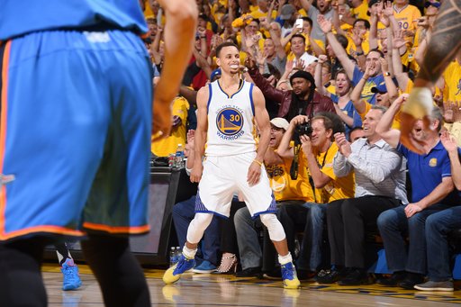 OAKLAND CA- MAY 18 Stephen Curry #30 of the Golden State Warriors celebrates during the game against the Oklahoma City Thunder in Game Two of the Western Conference Finals during the 2016 NBA Playoffs