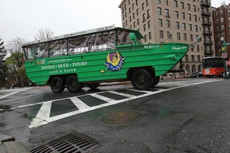 Boston MA. 05/02/16 A Duck Boat make the turn from Charles Street onto Beacon Street--the intersectioin where a woman on a scooter was killed by a Duck Boat. Globe staff  Suzanne Kreiter