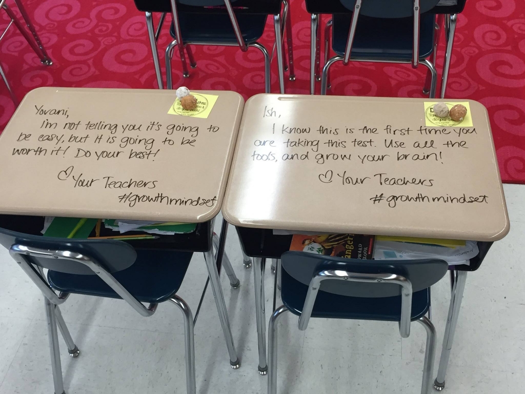 Teacher writes personalized messages on students' desks before big test