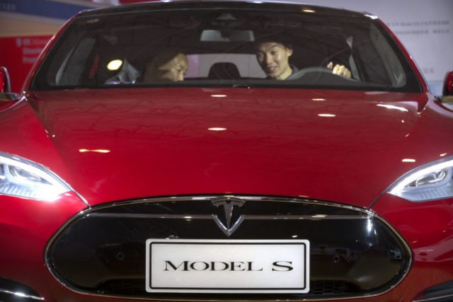 AFP  File  Johannes Eisele Tesla Model S cars at a showroom in Shanghai