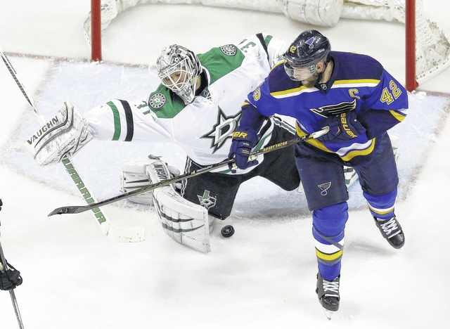 The Blues’ David Backes right deflects a puck past Dallas goalie Antti Niemi for a goal during Tuesday night’s playoff game in St. Louis