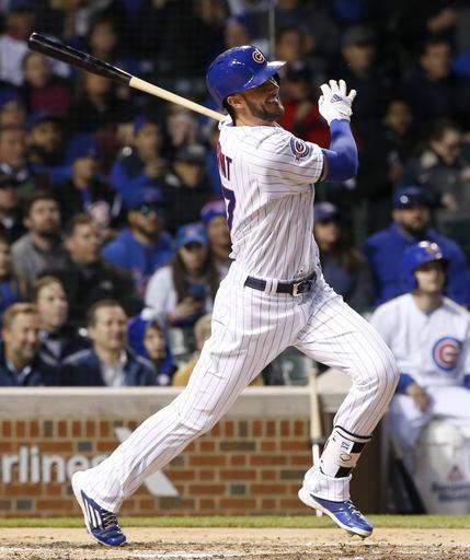 The Cubs Kris Bryant hits a ground-rule double against the Washington Nationals during the fourth inning on Thursday