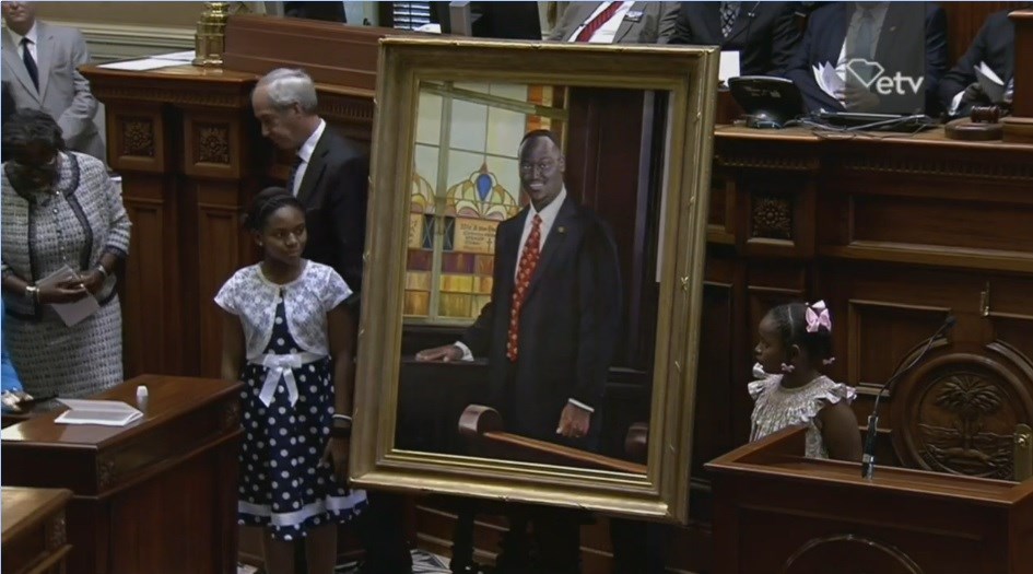 The daughters of the late Sen. Clementa Pinckney unveil a portrait in his honor at the South Carolina State House