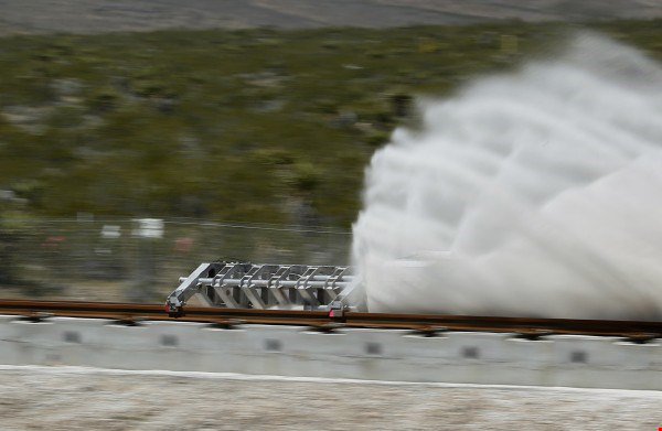 The sled speeding down a track during the testing of Hyperloop One propulsion system