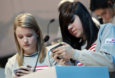 Kate Moore and Morgan Dynda of the U.S. compete in the LG Mobile Worldcup Texting Championship in New York