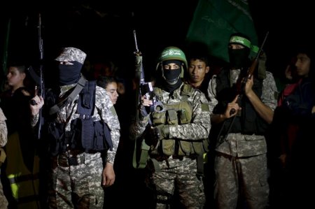 Palestinian Hamas militants take part in a rally marking Palestinian Prisoners Day in Gaza City