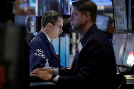 Traders work on the floor of the New York Stock Exchange in New York City U.S