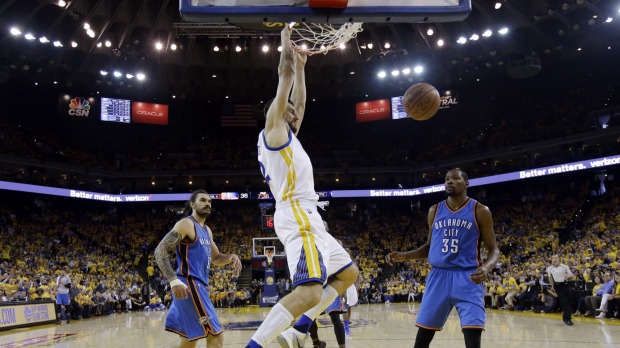 Throwing the hammer down Golden State centre Andrew Bogut dunks past Oklahoma City Thunder's Kevin Durant and Steven Adams