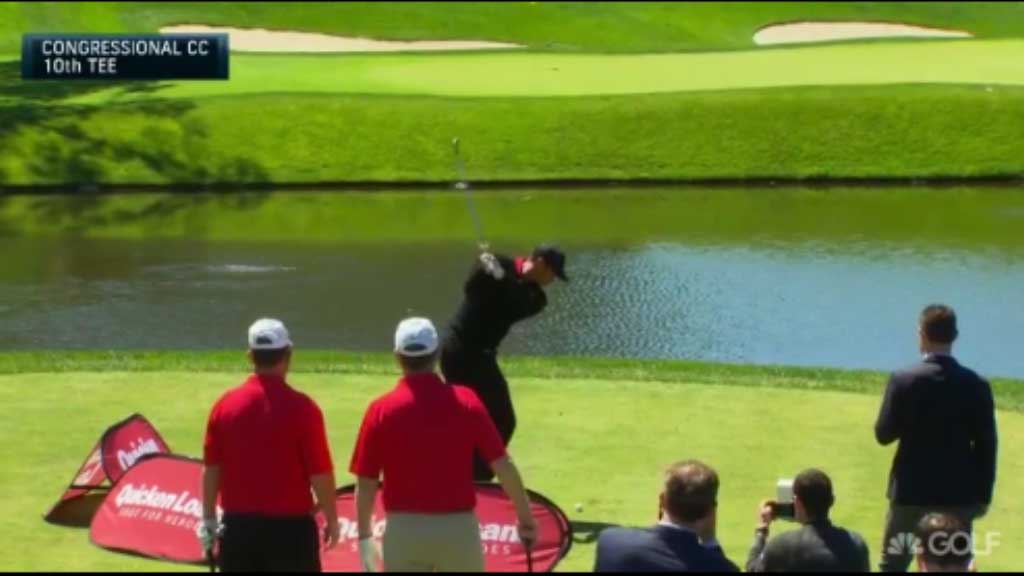 Woods fires three shots into water