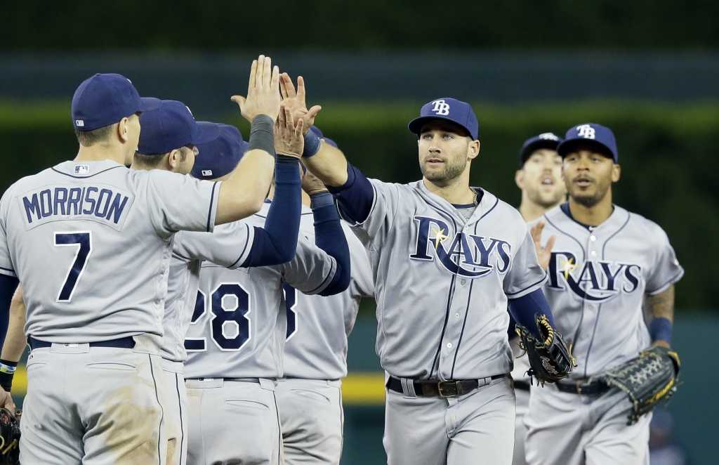 Tampa Bay Rays center fielder Kevin Kiermaier center leads teammates after their 7-5 win over the Detroit Tigers in a baseball game Friday