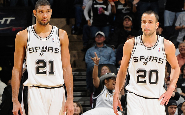 SAN ANTONIO- DECEMBER 9 Tim Duncan #21 and Manu Ginobili #20 of the San Antonio Spurs walk down the court during the game against the Sacramento Kings