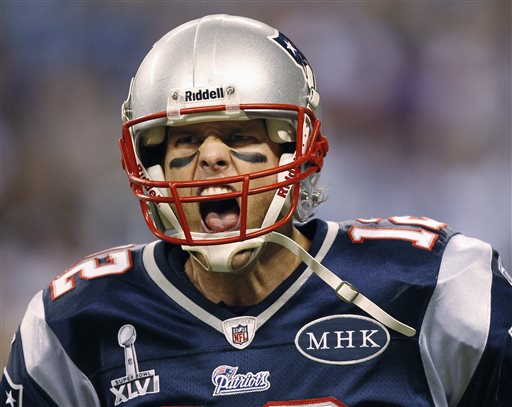 New England Patriots quarterback Tom Brady reacts after passing to Danny Woodhead for a touchdown during the first half of the NFL Super Bowl XLVI football game against the New York Giants in Indianapolis. Brady