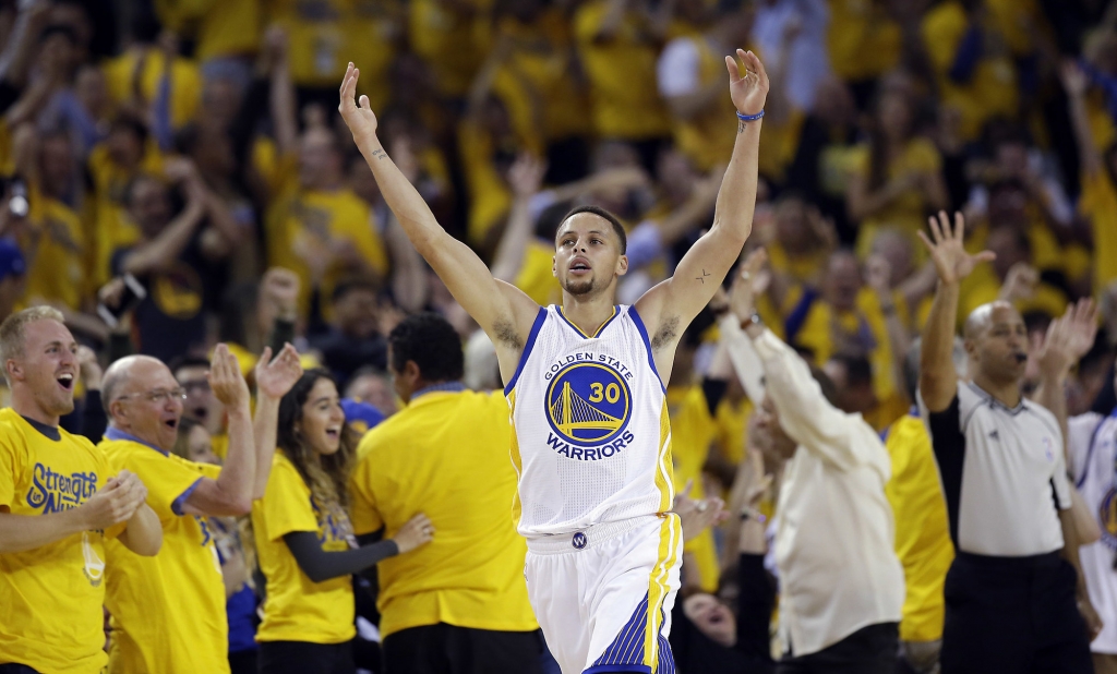 Golden State Warriors&apos Stephen Curry celebrates after scoring against the Portland Trail Blazers during the first half in Game 5 of a second-round NBA basketball playoff series Wednesday