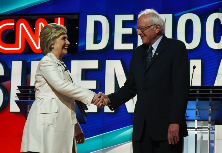 Democratic candidates Hillary Clinton and Bernie Sanders greet each other at the CNN Presidential Debate in Brooklyn N.Y