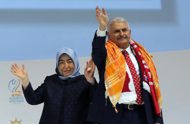 Binali Yildirim Turkey's current Transportation Minister and founding member of the AKP Turkey¿s governing party and his wife Semiha Yildirim salute suppo