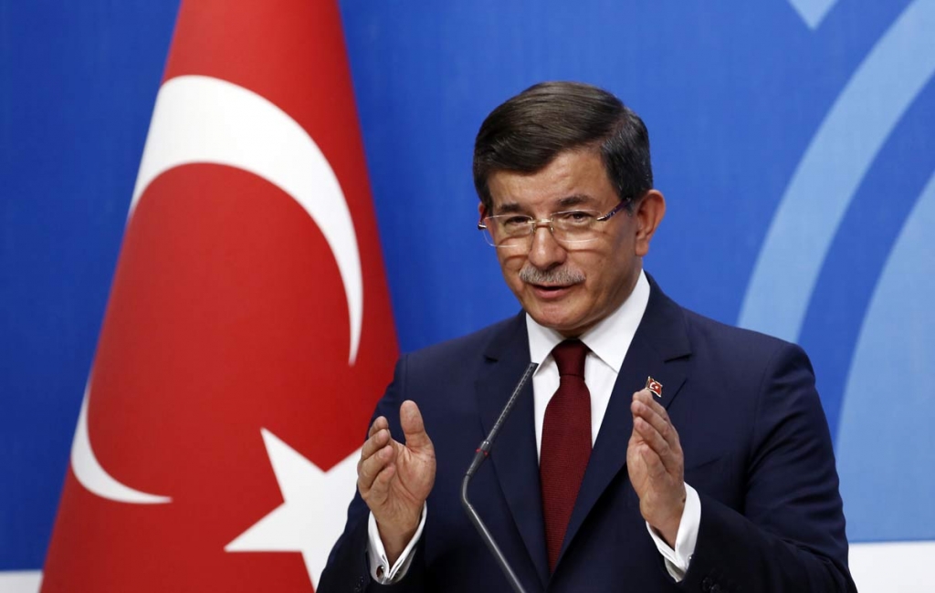 Turkish Prime Minister Ahmet Davutoglu speaks to the media at the headquarters of his ruling Justice and Development Party AKP in Ankara Turkey Thursday