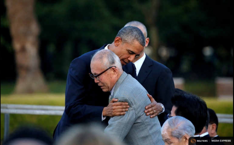 U.S. President Barack Obama hugs an atomic bomb survivor Shigeaki Mori as he visits Hiroshima Peace Memorial Park May 27