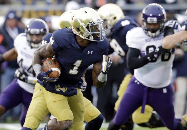 Notre Dame running back Greg Bryant runs with the ball against Northwestern during the first half of an NCAA college football