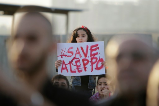 AFP  Ibrahim Chalhoub. A Syrian girl holds a placard during a rally in solidarity with Aleppo in the Lebanese northern port city of Tripoli