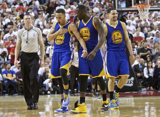 Golden State Warriors guard Stephen Curry left guard Klay Thompson right and forward Draymond Green center react during the second half of Game 4 of an NBA basketball second-round playoff series against the Portland