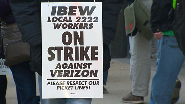 Verizon workers on the picket line outside the Verizon Building in Bowdoin Square in downtown Boston Wednesday