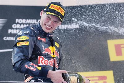 Infiniti Red Bull's Belgian Dutch driver Max Verstappen celebrates on the podium after the Spanish Formula One Grand Prix