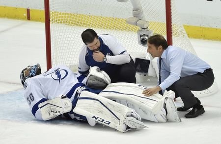 Pittsburgh PA USA Medical staff attend to Tampa Bay Lightning goalie Ben Bishop after being injured during the first period in