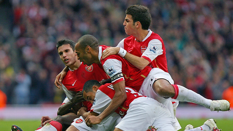 Walcott celebrating with Robin van Persie Thierry Henry and Cesc Fabregas