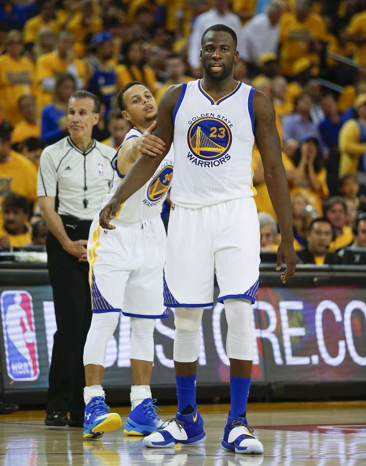 Draymond Green is restrained by Stephen Curry in the third quarter of Game 5 of the Western Conference finals