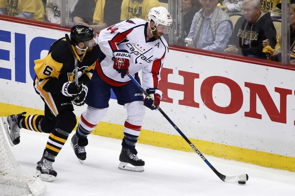 Washington Capitals Brooks Orpik clears the puck