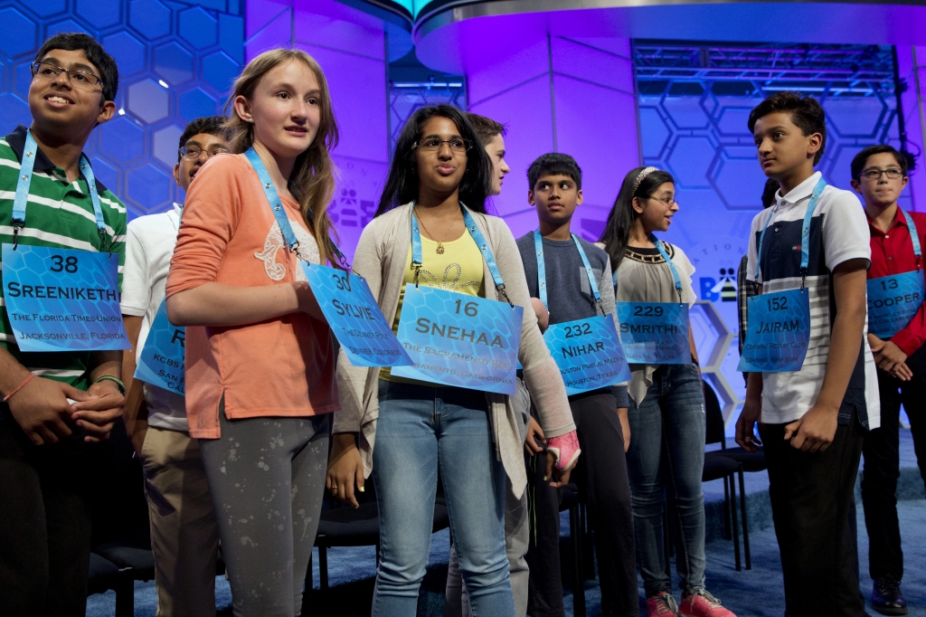 The final spellers who made it into the evening televised final round gather around on stage after the completion of the morning of competition of the 2016 National Spelling Bee in National Harbor Md. Thursday