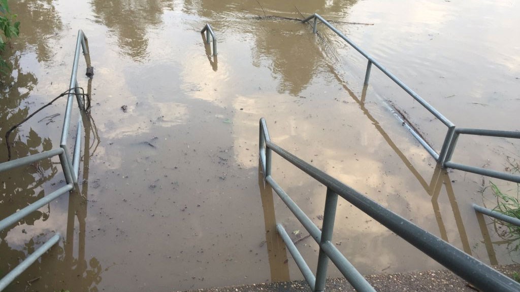 Water rising from the Colorado River near the Colorado River Bridge in Bastrop