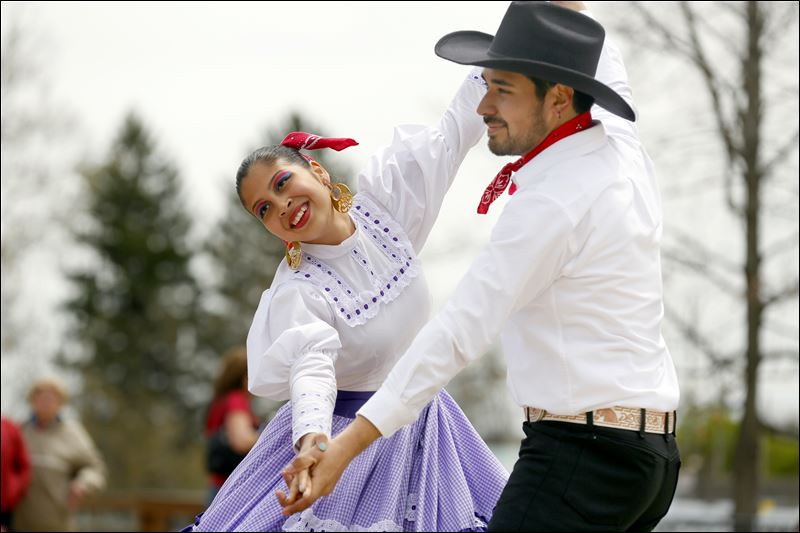 Araceli Balderas left and Hugo Ramirez perform with the El Corazon de Mexico Folklorico Dance Group in celebration of Cinco de Mayo in 2014 at The Toledo Zoo