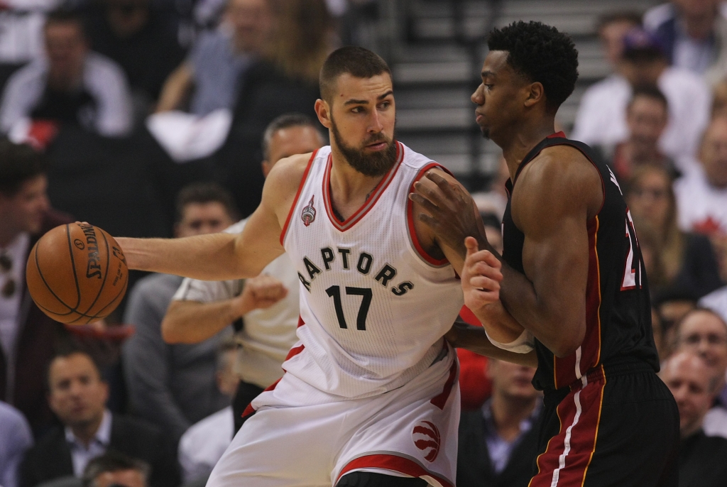 Jonas Valanciunas #17 of the Toronto Raptors drives to the basket against Hassan Whiteside #21 of the Miami Heat during Game One of the Eastern Conference Semifinals during the 2016 NBA Playoffs