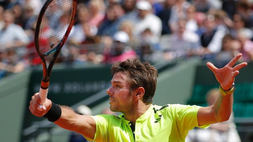 Switzerland's Stan Wawrinka returns in his second round match of the French Open tennis tournament against Japan's Taro Daniel at the Roland Garros stadium in Paris France Wednesday