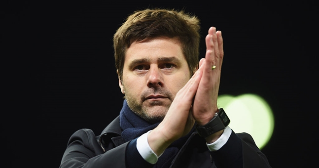 STOKE ON TRENT ENGLAND- APRIL 18 Mauricio Pochettino manager of Tottenham Hotspur applauds the travelling fans after victory in the Barclays Premier League match between Stoke City and Tottenham Hotspur at the Britannia Stadium